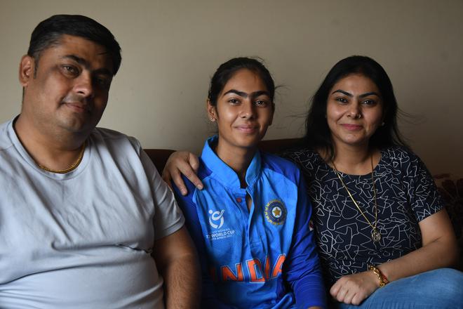 Parshavi Chopra with her parents. She credits their unflinching support for her development as a player.