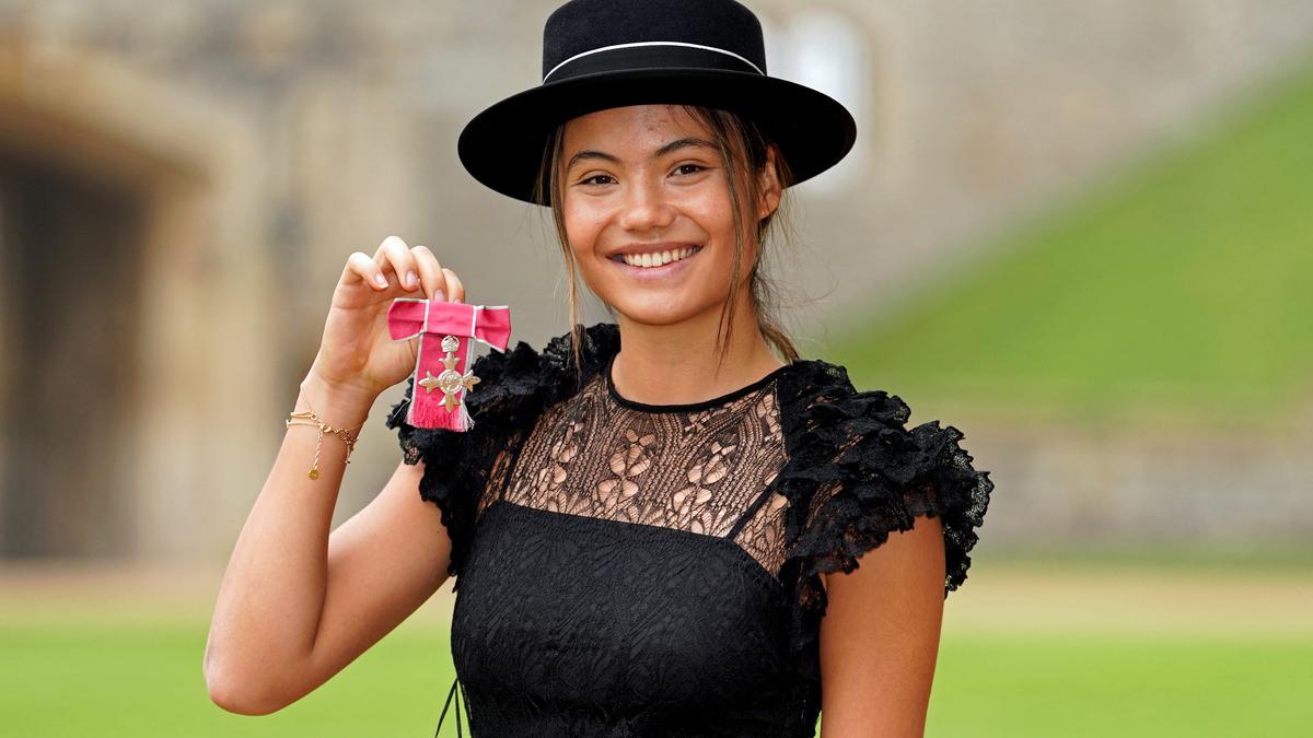 Emma Raducanu receives MBE from King Charles III for services to tennis