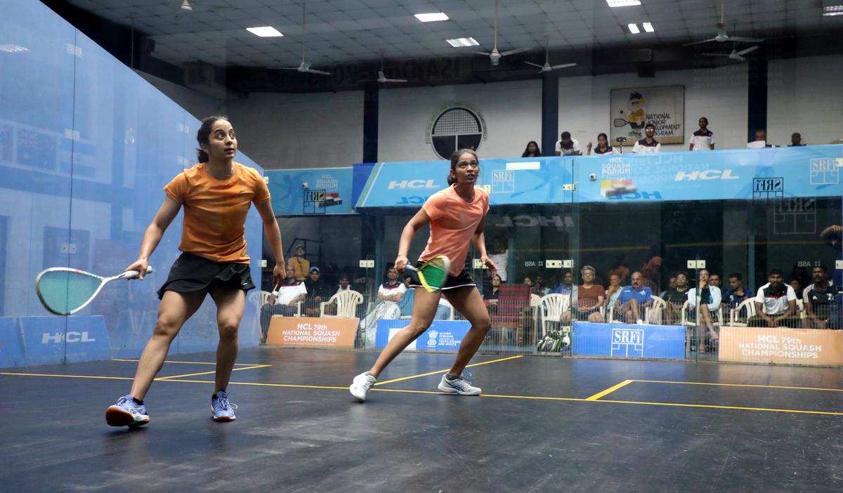 Tanvi Khanna (L) and Rathika S Seelan in action during the women’s semifinals 79th National Squash championship. 