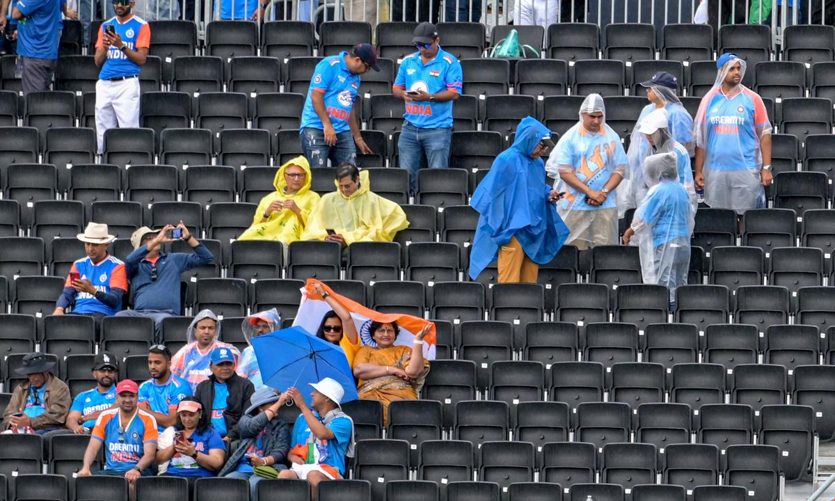 Fans braving the rain before the start of the ICC Men’s T20 World Cup cricket match between India and Pakistan at the Nassau County International Cricket Stadium. 