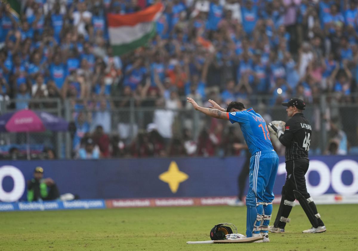 India’s Virat Kohli celebrates his 50th century, breaking Sachin Tendulkar’s most ODI hundreds record, during the ICC Men’s Cricket World Cup 2023 semi-final match between India and New Zealand. 