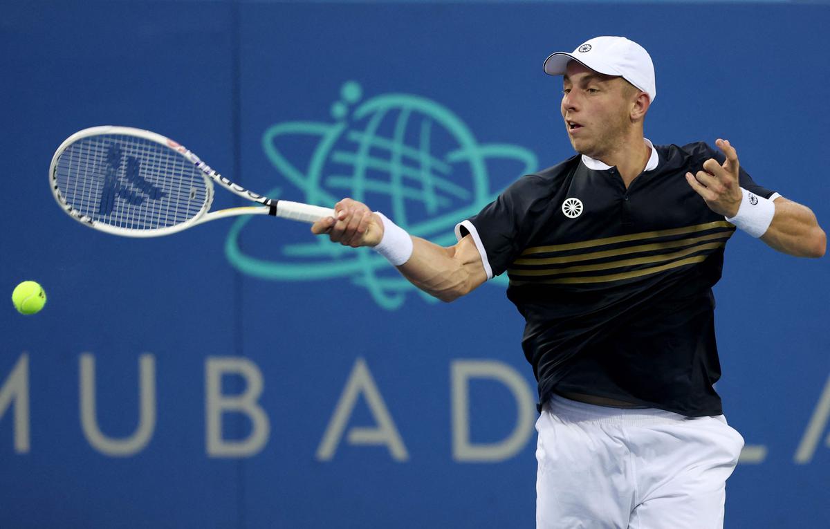 Tallon Griekspoor of the Netherlands returns a shot to Taylor Fritz.