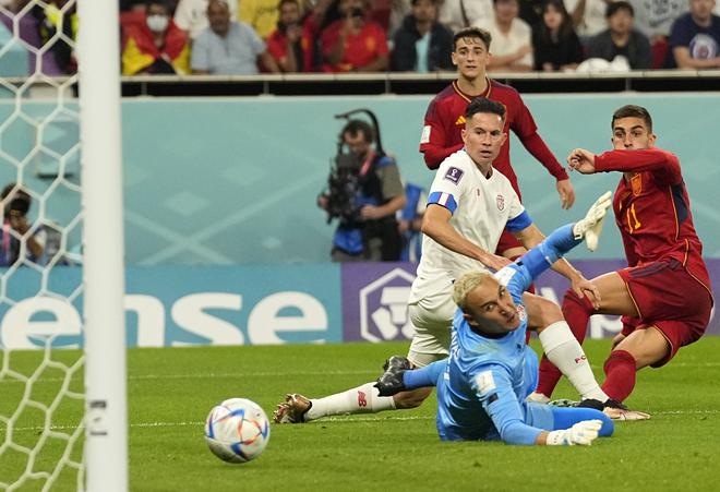 Spain’s Ferran Torres, right, scores his side’s fourth goal during the World Cup group E soccer match between Spain and Costa Rica, at the Al Thumama Stadium in Doha, Qatar.
