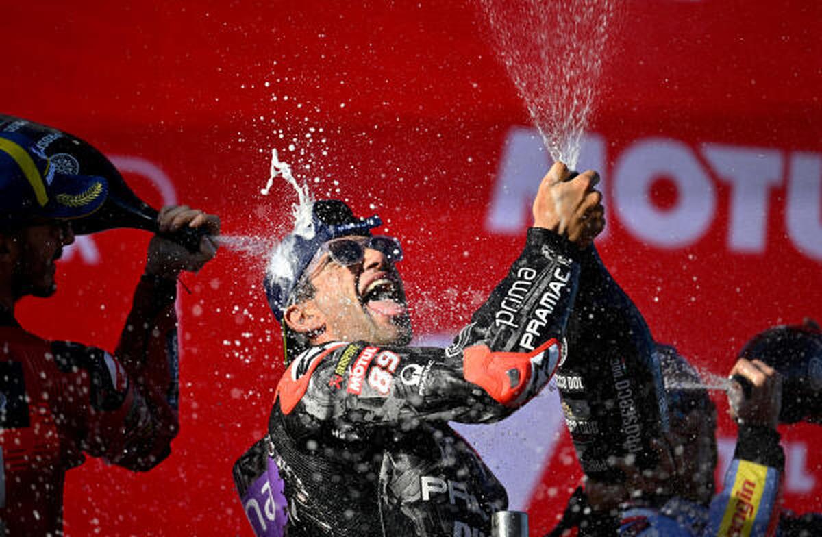 Prima Pramac Racing’s Jorge Martin celebrates on the podium after winning the MotoGP World Championship alongside Ducati Lenovo Team’s Francesco Bagnaia and Gresini Racing MotoGP‘s Marc Marquez.