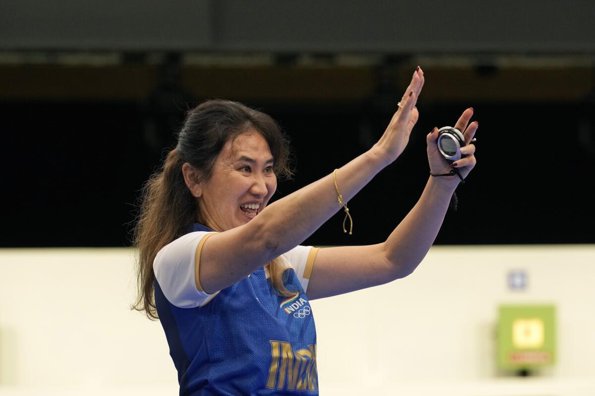 India’s coach Munkhbayar Dorjsuren celebrated after Manu Bhaker and Sarabjot Singh won the bronze medal in the 10m air pistol mixed team event.