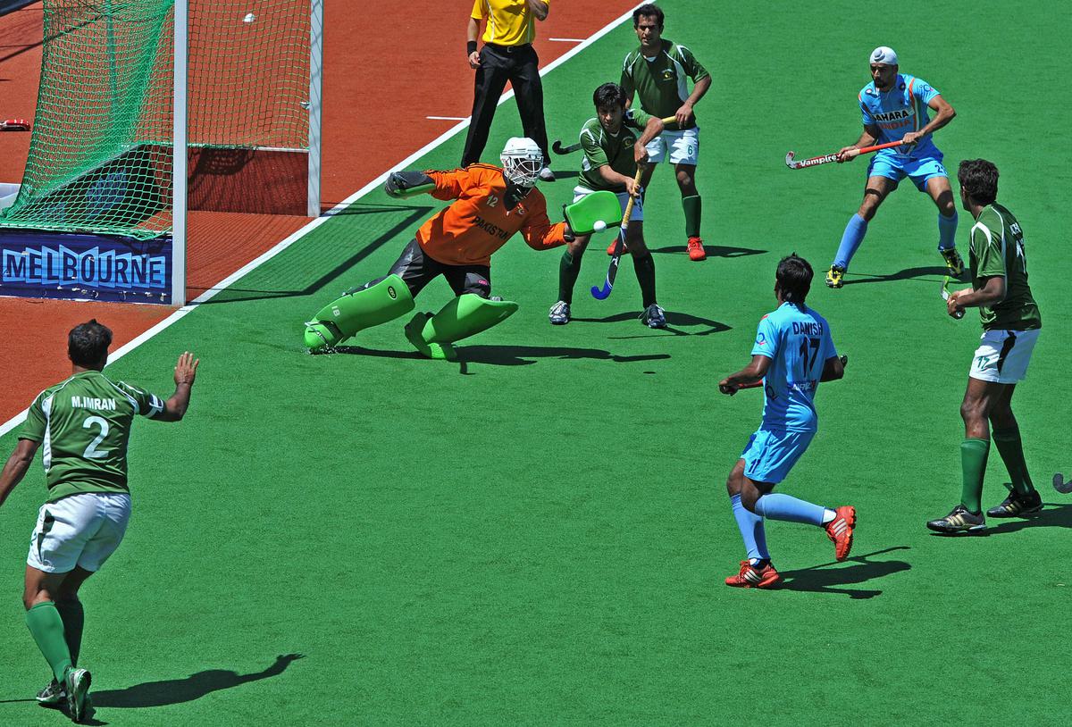 Imran Butt of Pakistan deflects the ball in front of goal during the bronze medal match against India at the men’s Champions Trophy tournament in Melbourne on December 9, 2012.