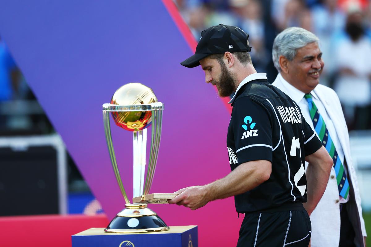 Agony: Kane Williamson walks past the World Cup trophy after England beat New Zealand to win the 2019 ODI World Cup. 