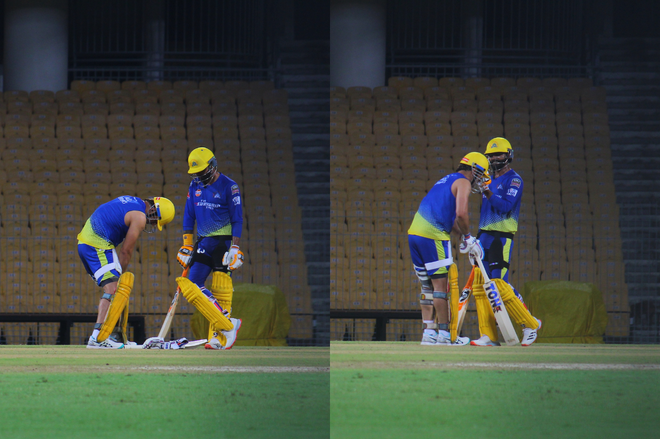 Dhoni (L) was seen limping and assessing his strapped left knee while batting twice in the middle.