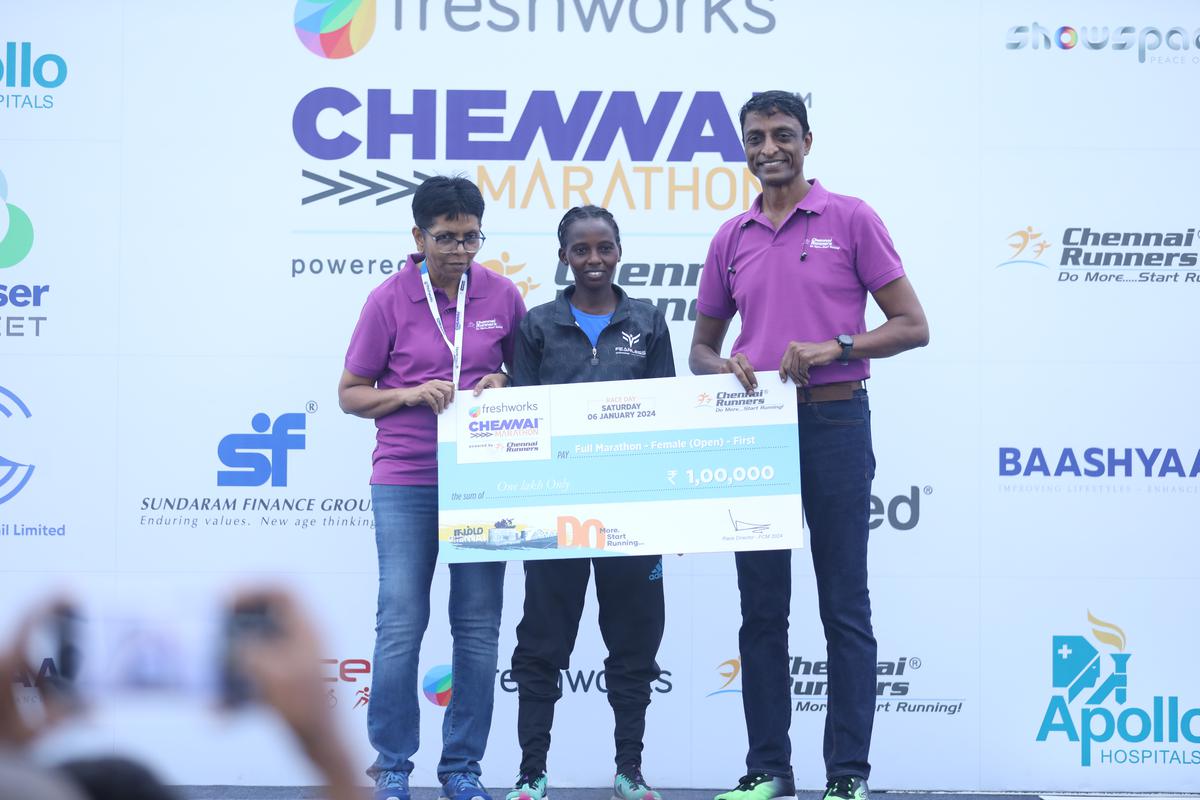 Women’s full marathon champion Sheilah Jepkorir (centre) flanked by with Lakshmi and Senthilkumar.