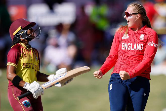 England’s Sophie Ecclestone (R) celebrates after the dismissal of West Indies’ Zaida James (L) 