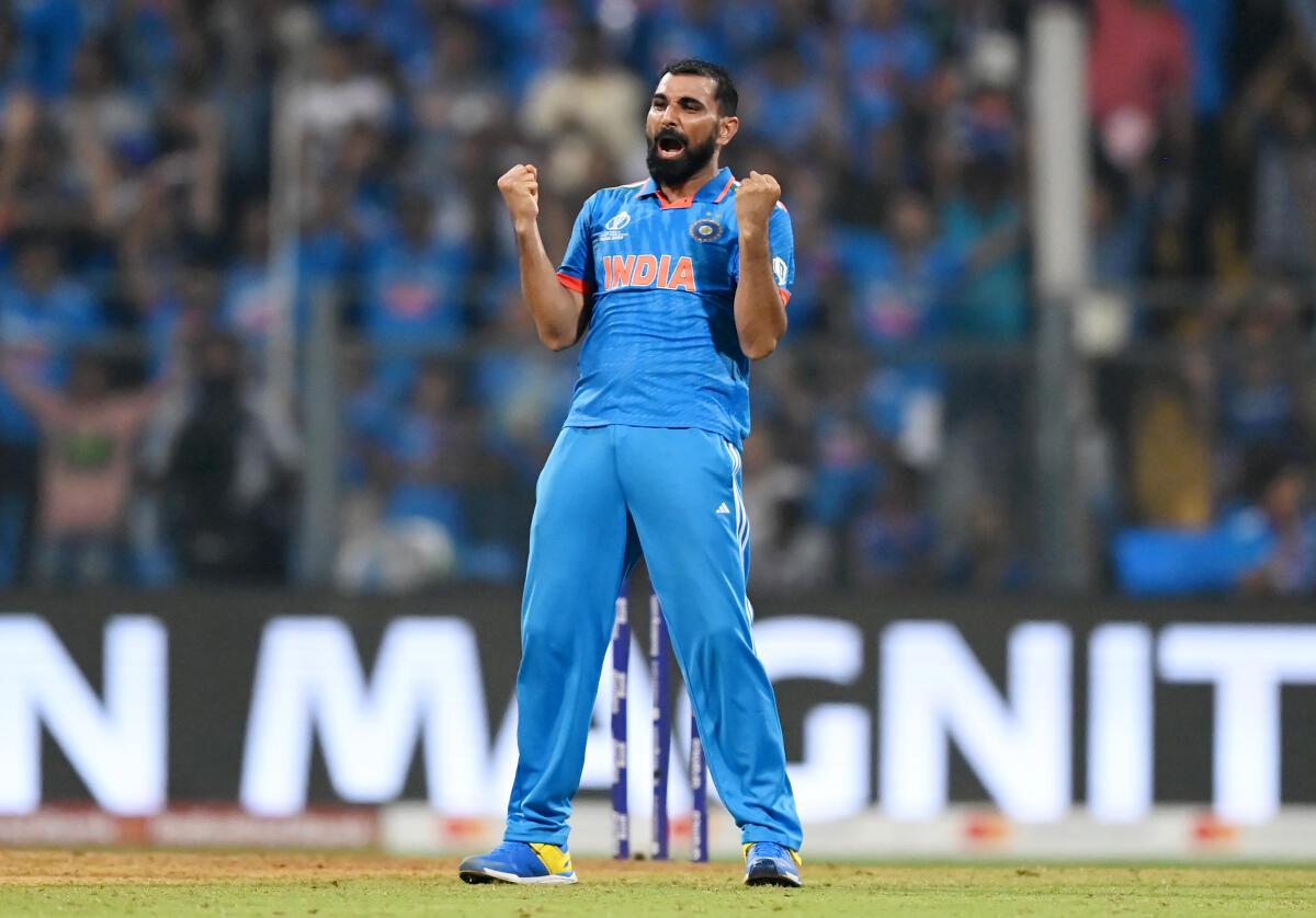 India’s Mohammed Shami celebrates the dismissal of New Zealand’s Daryl Mitchell. 