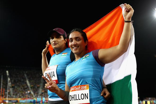 Silver medallist Seema Punia of India and bronze medallist Navjeet Dhillon of India celebrate after the Women’s Discus final at the Gold Coast 2018 Commonwealth Games.