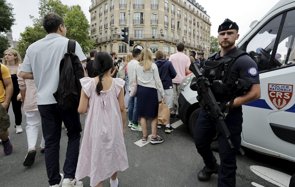 French police forces secure the perimeter ahead of the Opening Ceremony of the Paris 2024 Olympic Games, in Paris, France, 26 July 2024. 