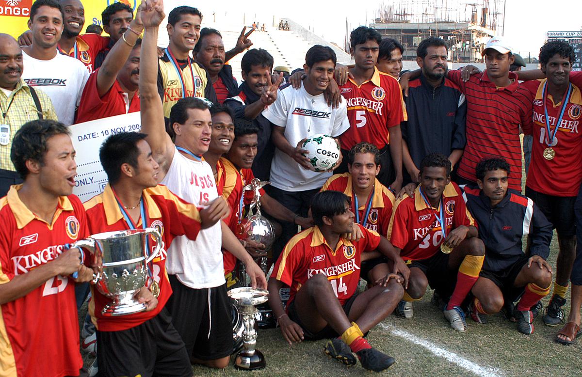 The East Bengal Team celebrates with the Durand Cup title at the Ambedkar Stadium in New Delhi.