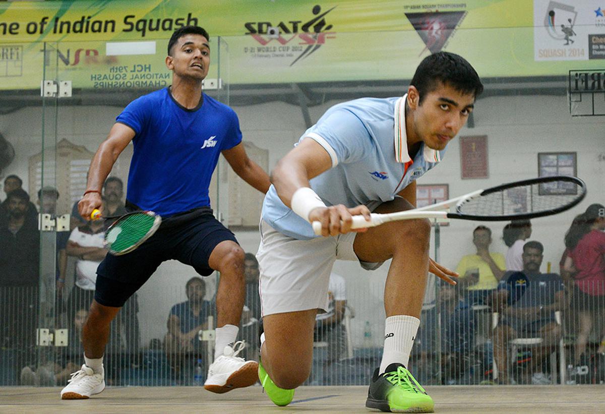 Abhay Singh (R) and Mohit Bhatt in action in the men’s round-of-16 match of the 79th National Squash Championships. 