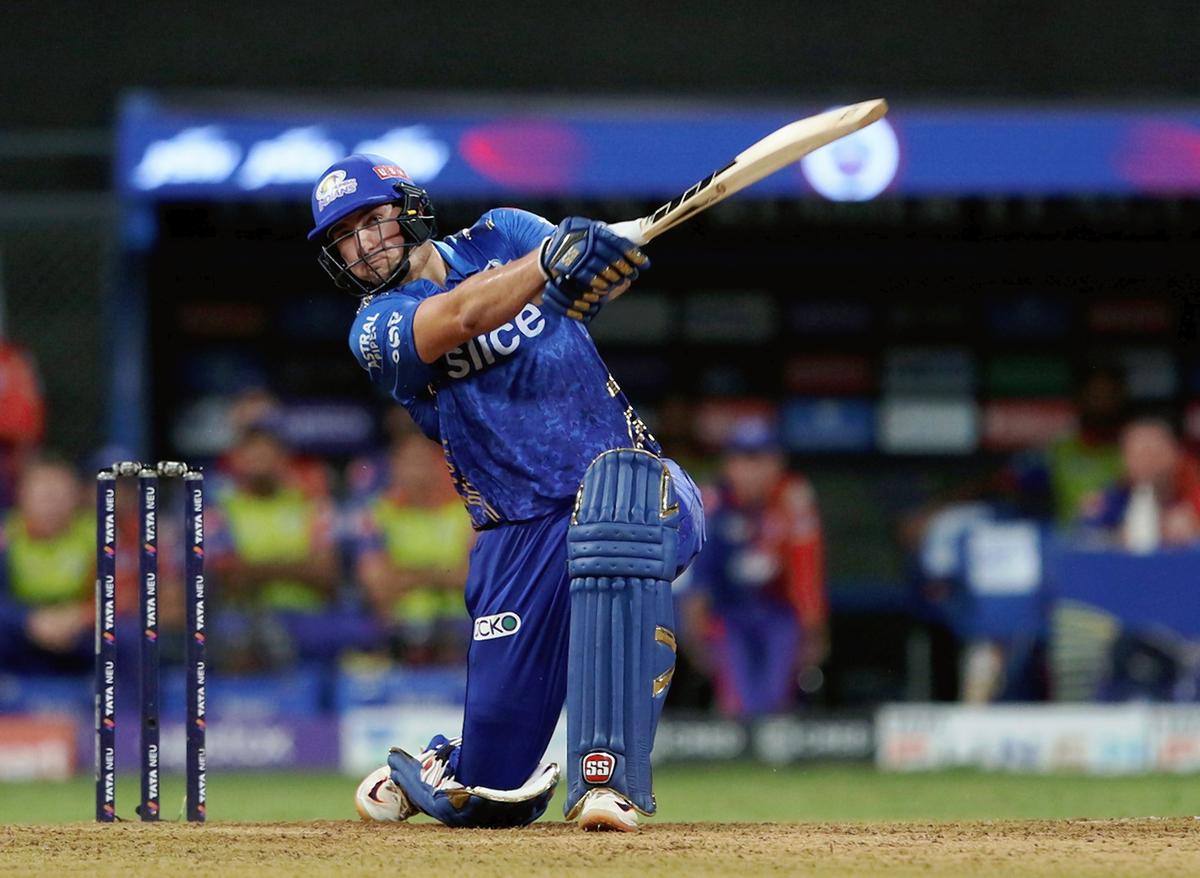 FILE PHOTO: Tim David of Mumbai Indians  plays a shot during match 69 of the TATA Indian Premier League 2022 (IPL season 15) between the Mumbai Indians and the Delhi Capitals.