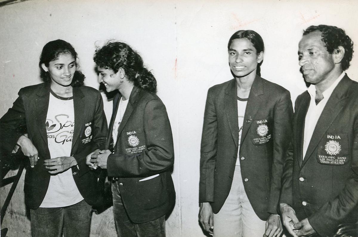 Members of the 4x400 Indian relay squad that made the finals in the Los Angeles Olympic Games in 1984, Vandana Rao (left), Shiny Abraham and P.T. Usha with coach Nambiar.