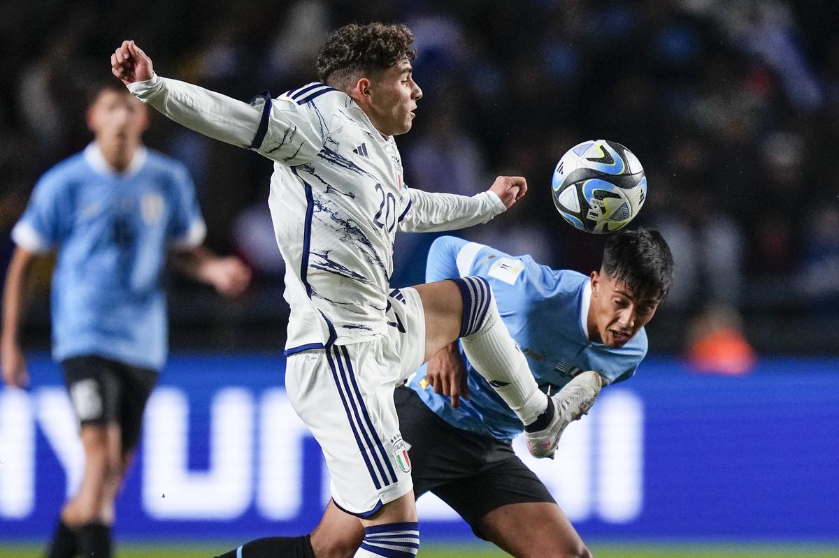 Italy’s Simone Pafundi, front, and Uruguay’s Fabricio Diaz vie for the ball during the FIFA U-20 World Cup final. 