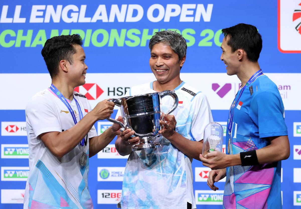 File photo | Jonatan Christie and Anthony Sinisuka Ginting of Indonesia celebrate with Coach Irwansyah after the Men’s Final at the All England Open Badminton Championships 2024 in Birmingham. 