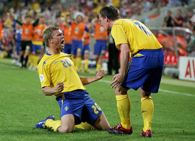 Marcus Allback of Sweden celebrates scoring a goal with Anders Svensson of Sweden during the FIFA World Cup Germany 2006 Group B match between Sweden and England at the Stadium Cologne on June 20, 2006 in Cologne, Germany.
