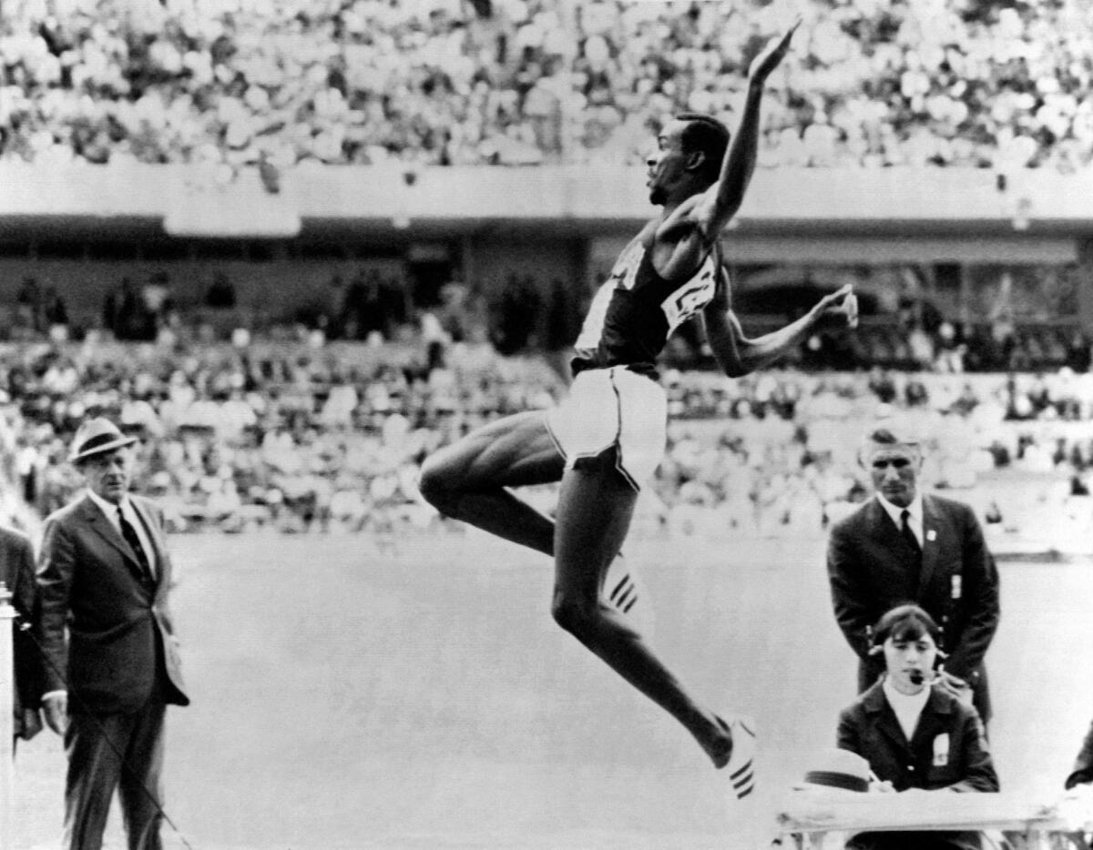 Bob Beamon competes in the men’s long jump event at the Mexico Olympic Games on October 18, 1968. 