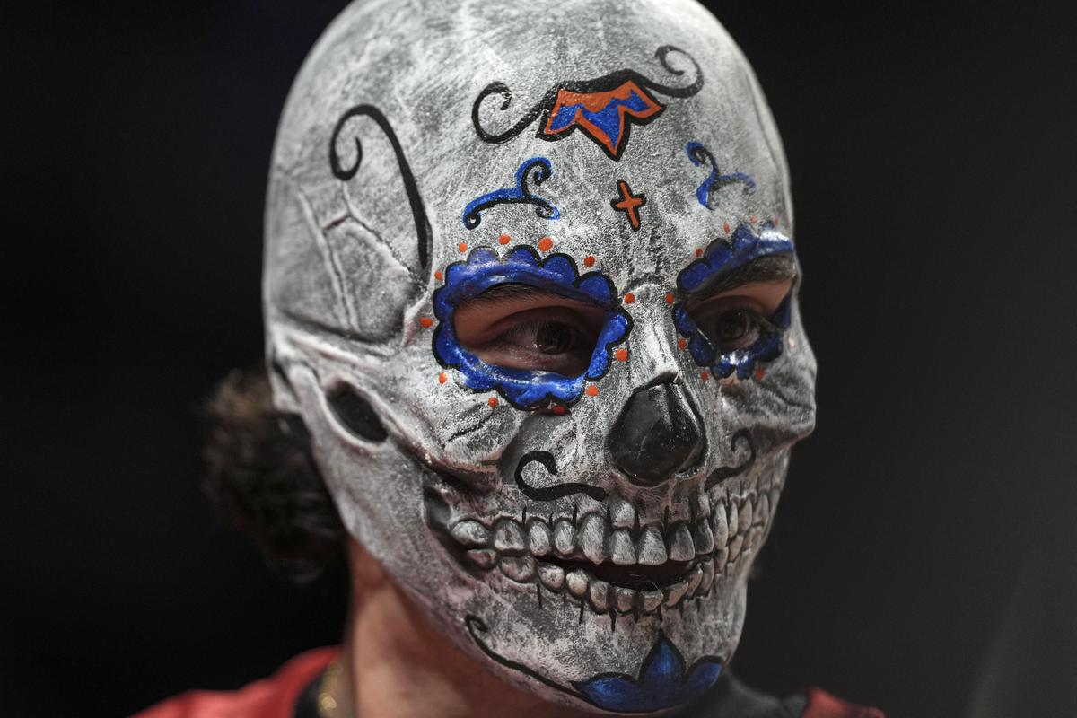 Miami Heat’s Jaime Jaquez Jr. wore a Day of the Dead mask before the start of a practice session on Friday.