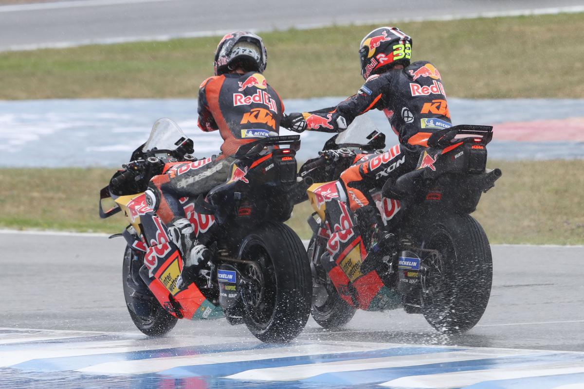 The race started under grey clouds and rain began to fall three laps in,