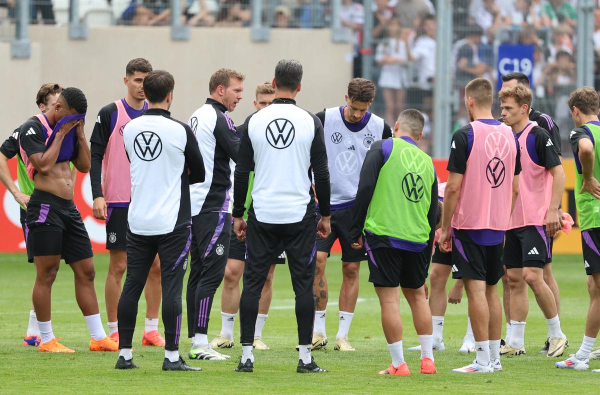 Germany coach Julian Nagelsmann speaks to his players during training.