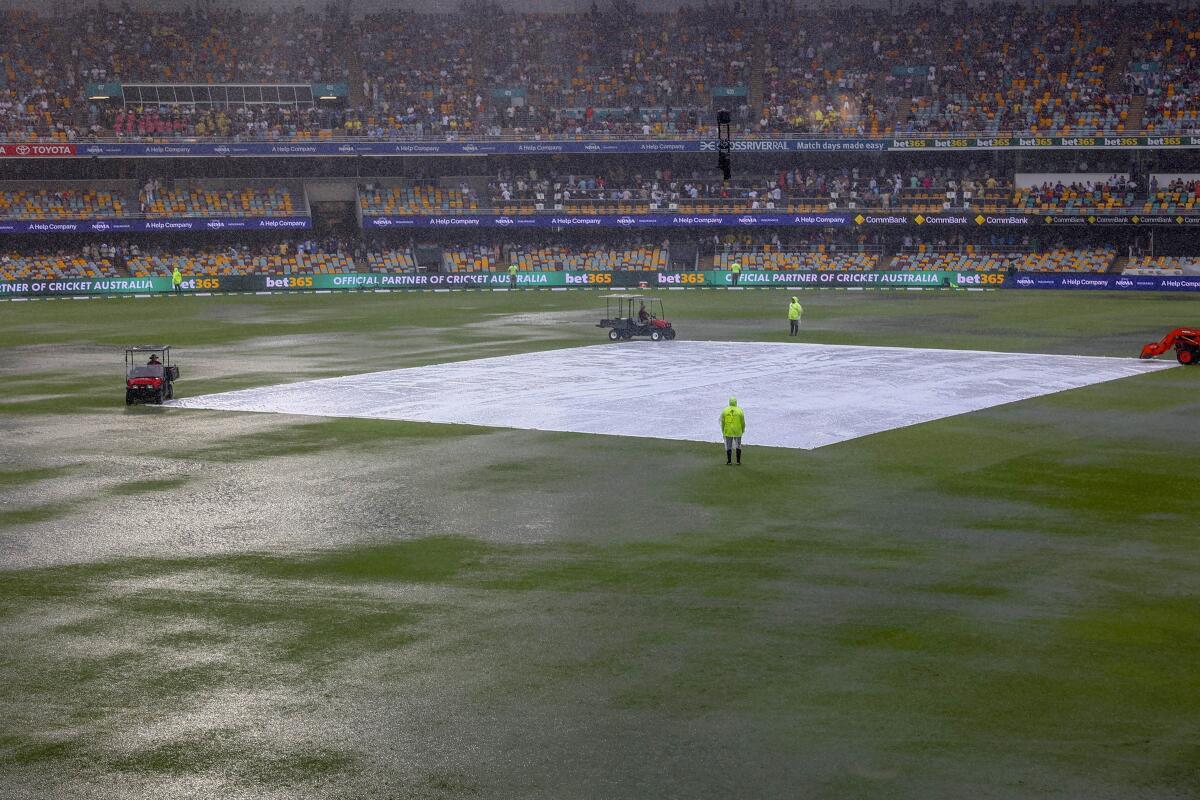 General view of covers on the pitch as it rains during play on day one of the third Test.