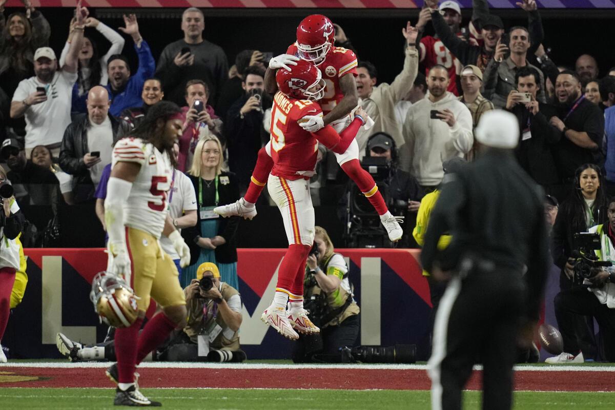 Kansas City Chiefs quarterback Patrick Mahomes celebrates with wide receiver Mecole Hardman Jr. after Hardman scored the game-winning touchdown against the San Francisco 49ers in overtime during the NFL Super Bowl 58 football game, Feb. 11, 2024, in Las Vegas