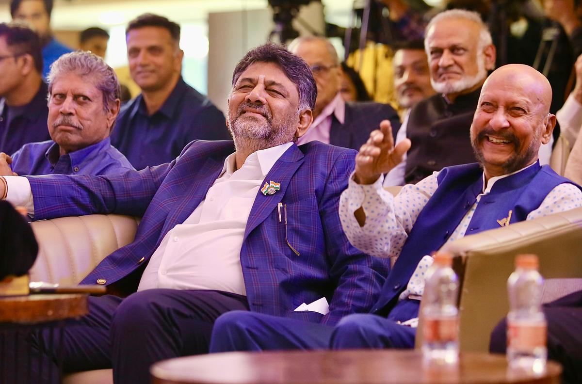 Deputy Chief Minister D. K. Shivakumar during the launch ofÂ  âStumped, Life Behind And Beyond The Twenty-Two Yards âÂ with Krimani (right).