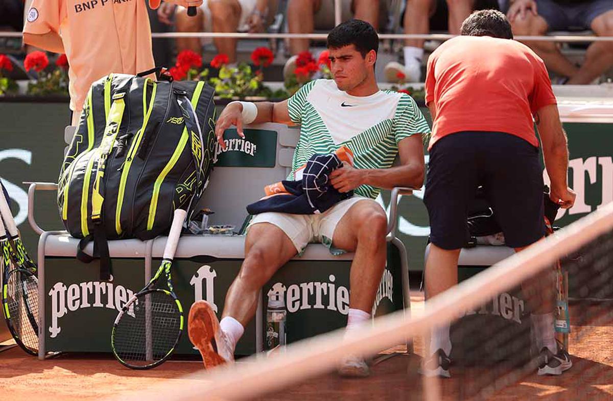 FILE PHOTO: Carlos Alcaraz suffering from cramps during the French Open 2023 semifinal against Novak Djokovic.