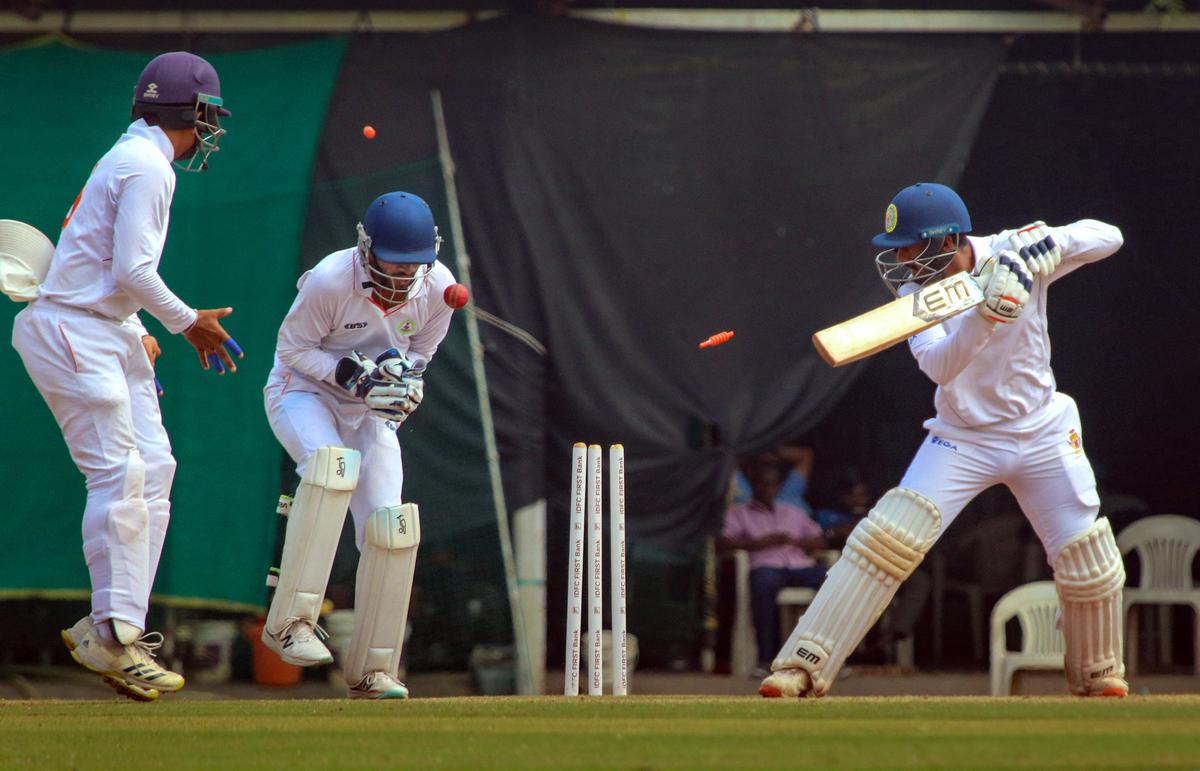 Karnataka’s batter S. Sharath being bowled out by Vidarbha’s bowler Harsh Dubey during the Ranji Trophy quarterfinal. 