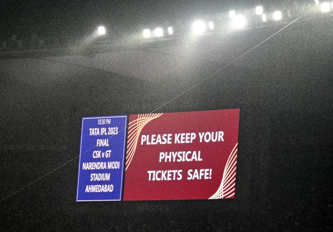 The giant screen holds a message for spectators as the rain continues in Ahmedabad.