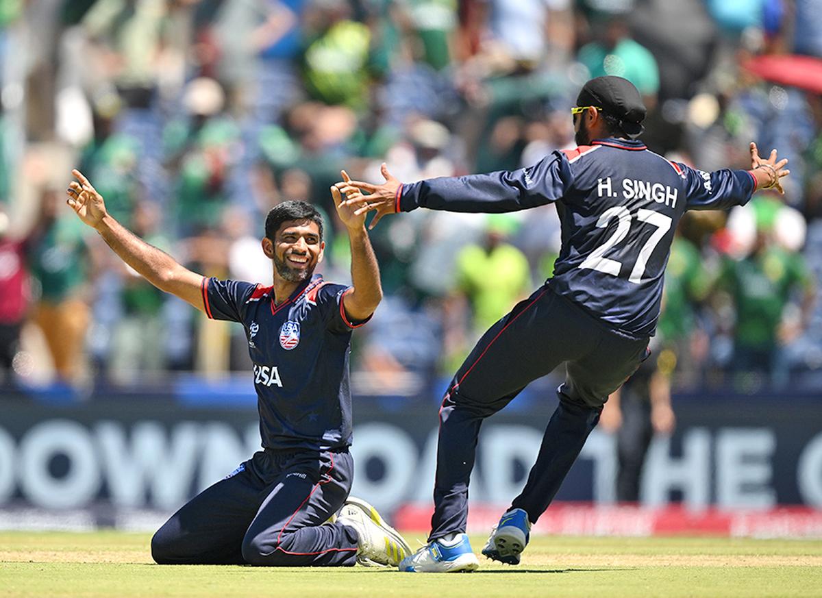 Saurabh Netravalkar of USA celebrates with teammate Harmeet Singh after USA defeated Pakistan in the Super Over. 