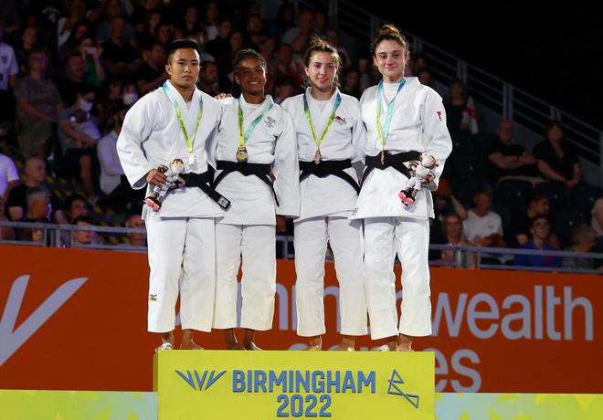 Silver medallist Shushila Likmabam (left) on the podium after her women’s 48kg Judo final. 