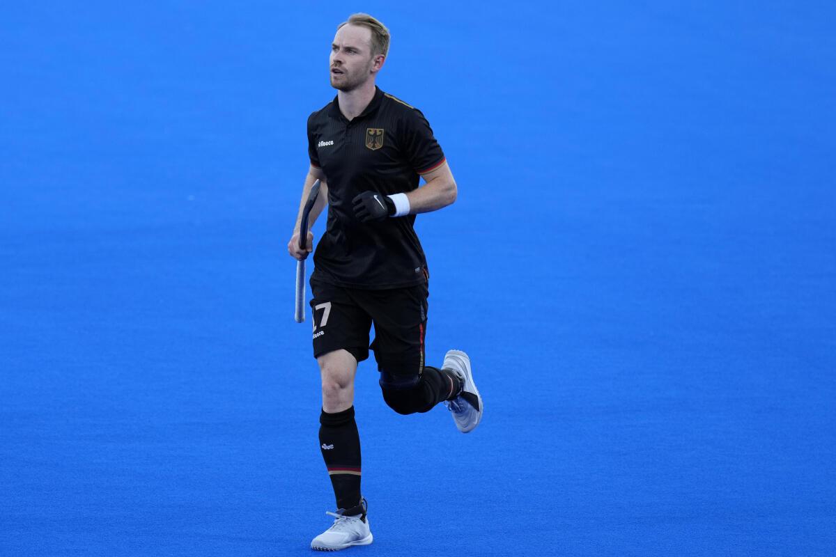 Germany’s Christopher Ruhr celebrates with teammates after scoring his side’s second goal during the men’s semifinal field hockey match between Germany and India. 