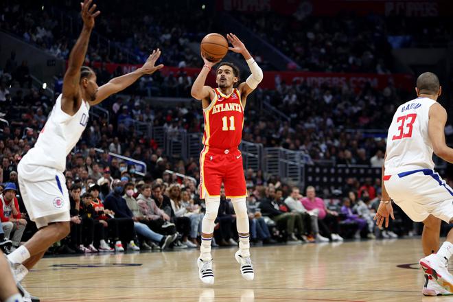 Atlanta Hawks guard Trae Young (11) shoots the ball against Los Angeles Clippers forward Kawhi Leonard (2) during the second quarter at Crypto.com Arena. 