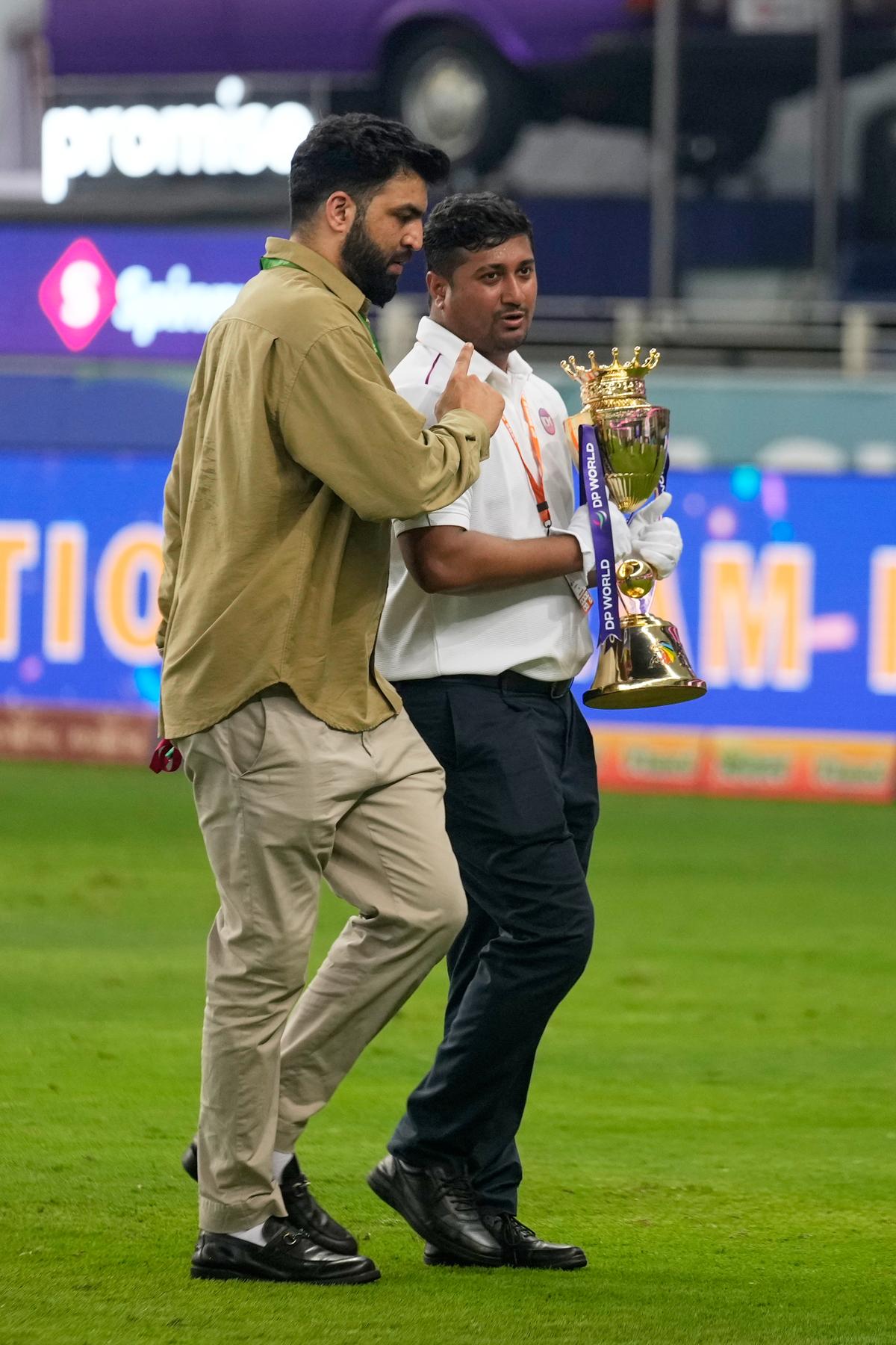 Pandemonium: Officials quietly cleared the podium as the winner’s trophy was whisked away after India’s triumph over Pakistan in the Asia Cup final, leaving the champion to celebrate an invisible prize amid confusion and delay.
