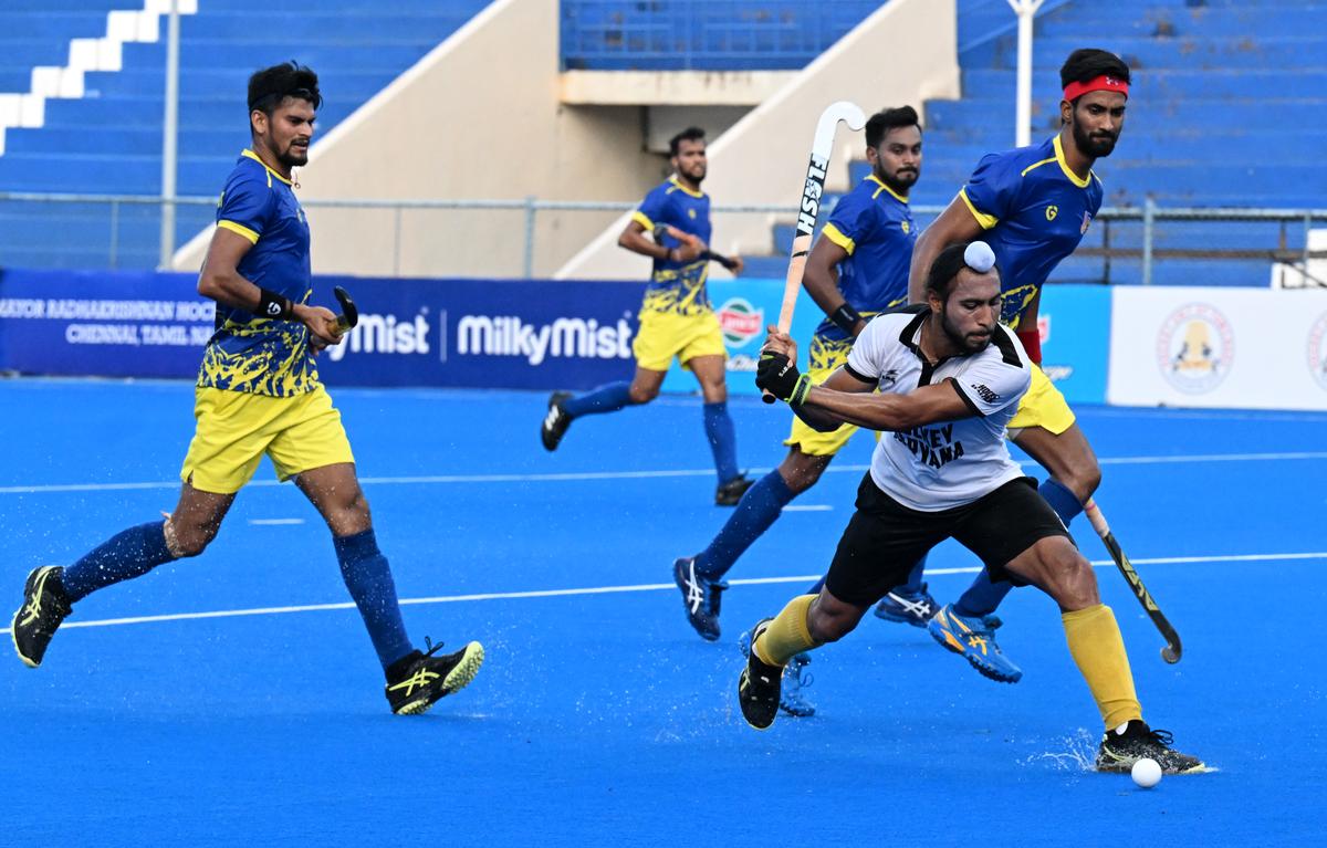 Rajinder Singh (Left 8 White jersey) of Hockey Haryana in action against Uttar Pradesh Hockey during semi final match at the 14th Hockey India Senior Men National Championship at the Mayor Radhakrishnan Stadium, Egmore in Chennai on Friday.