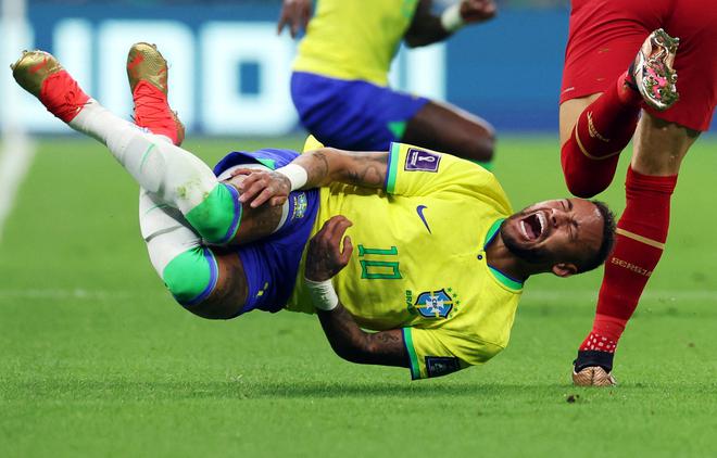 Brazil’s Neymar reacts after a challenge from Serbia’a Sasa Lukic.