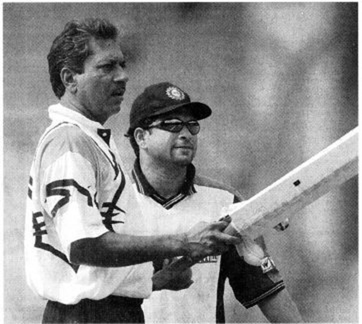 Sachin Tendulkar and Aunshuman Gaekwad assess the performance of players during a practice session at the MA Chidambaram Stadium in Chennai.