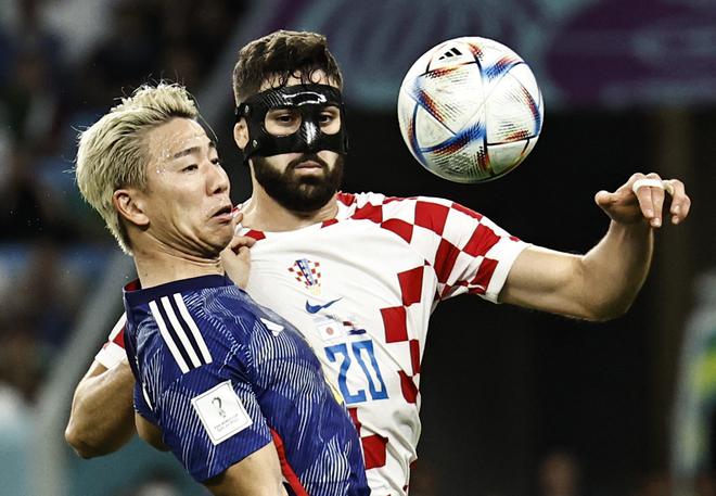 Croatia’s Josko Gvardiol in action with Japan’s Takuma Asano. 