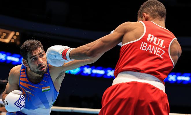 Close shave: Mohammad Hussamuddin in action during his victorious quarter-final bout.