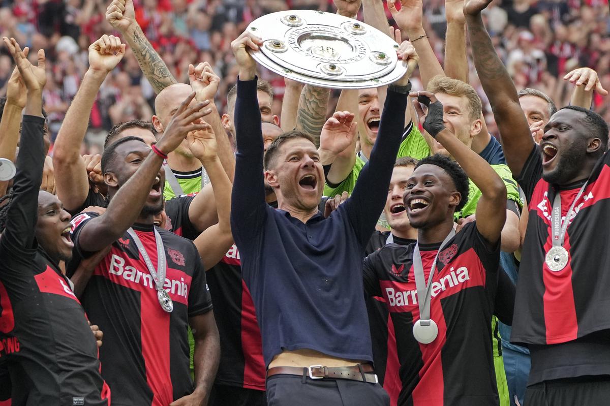 FILE PHOTO: Bayer Leverkusen stayed undefeated last season to snap Bayern’s 11-year reign as German champion and completed a domestic double by winning the German Cup to underscore its credentials as the country’s best team.