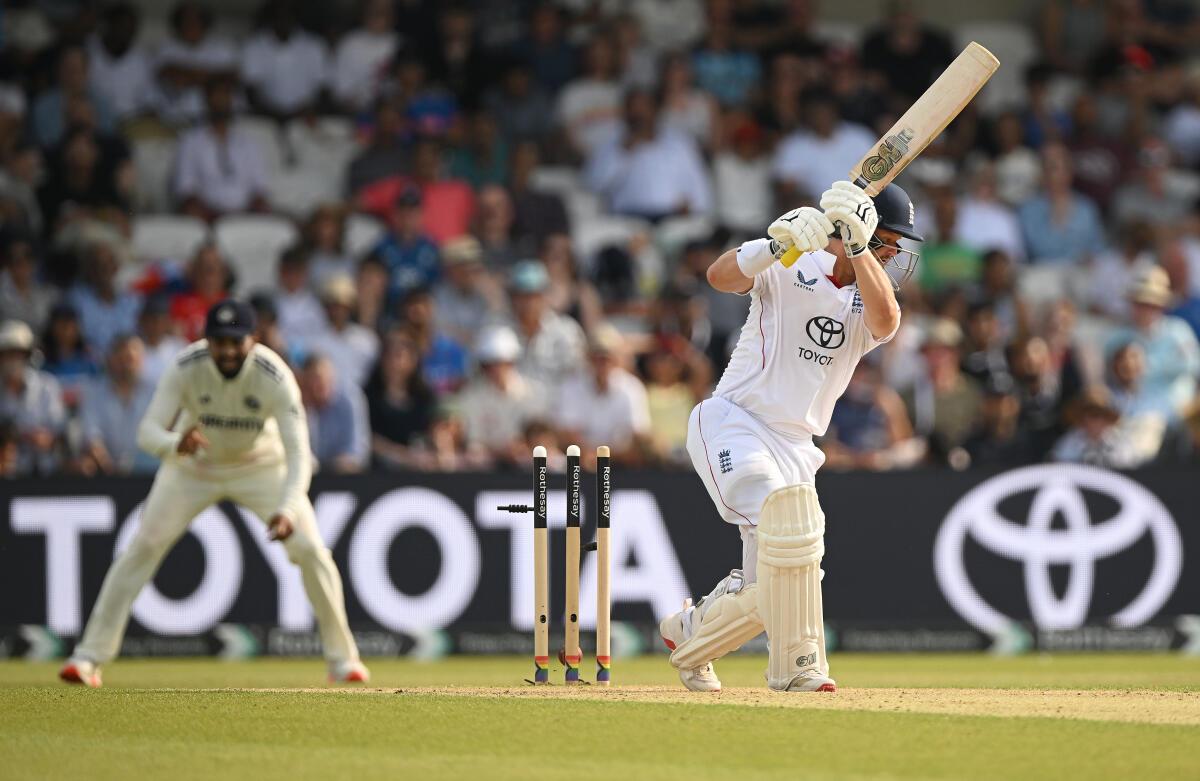 Ben Duckett of England is bowled by Jasprit Bumrah of India. 