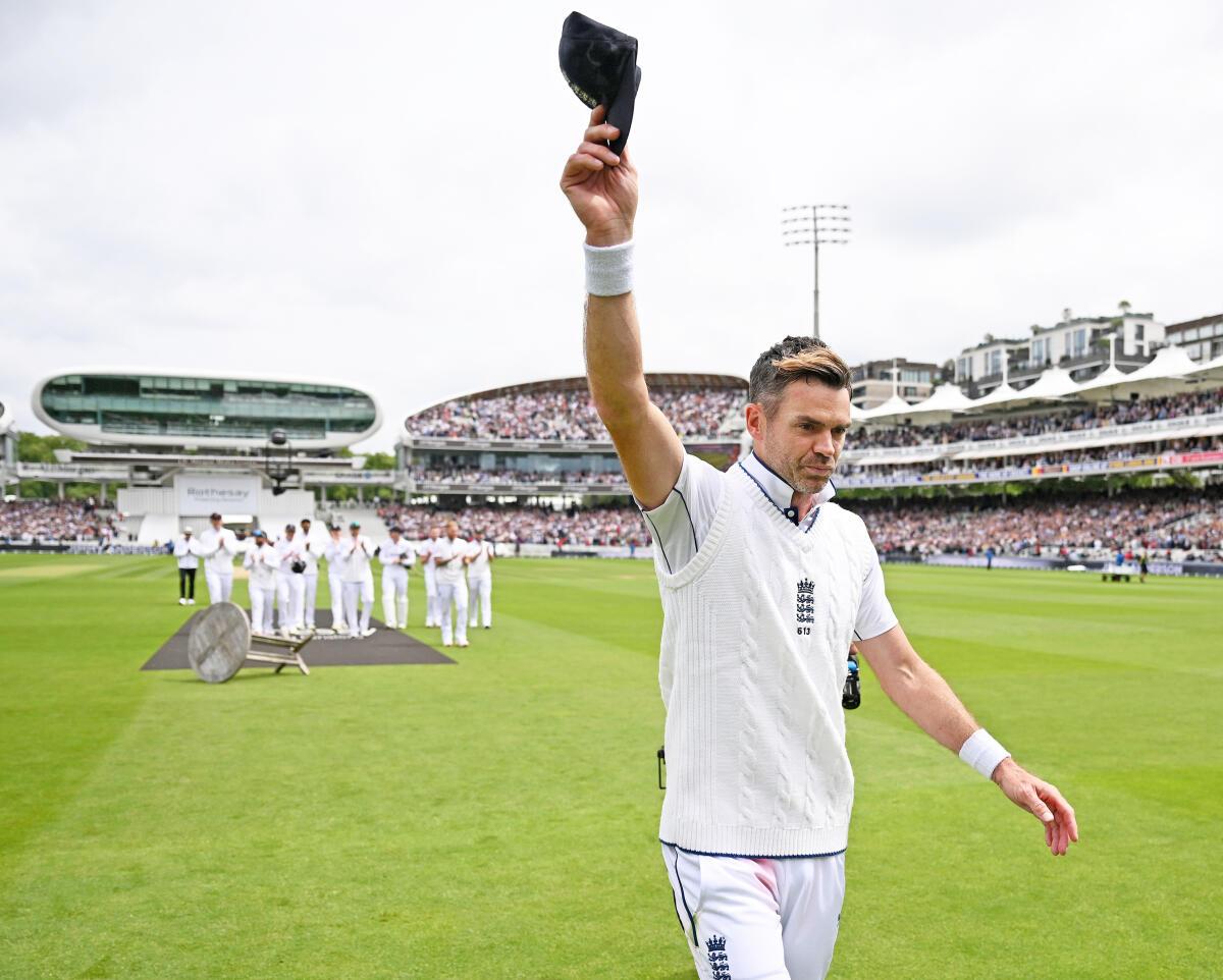 James Anderson of England leaves the field after his final Test appearance. 