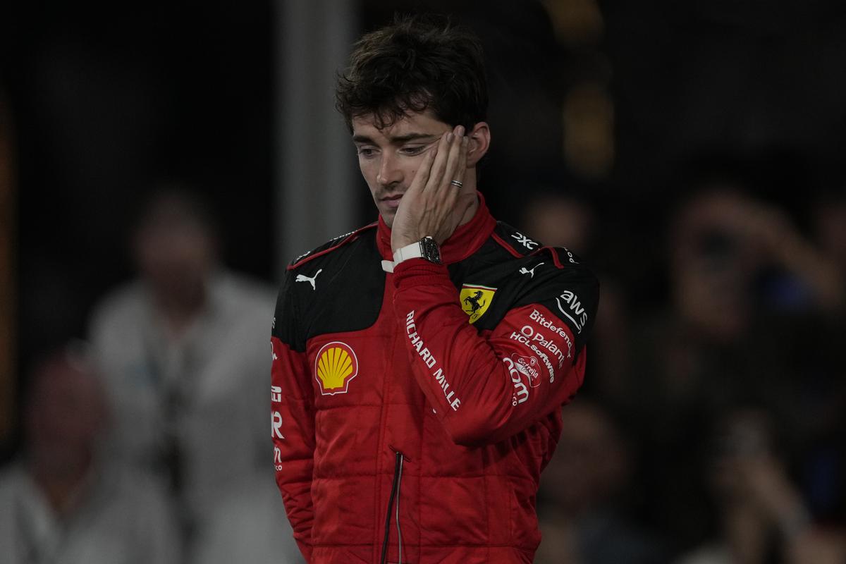 FILE PHOTO: Ferrari driver Charles Leclerc of Monaco reacts on the podium after placing second at the Abu Dhabi Formula One Grand Prix race at the Yas Marina Circuit, Abu Dhabi.