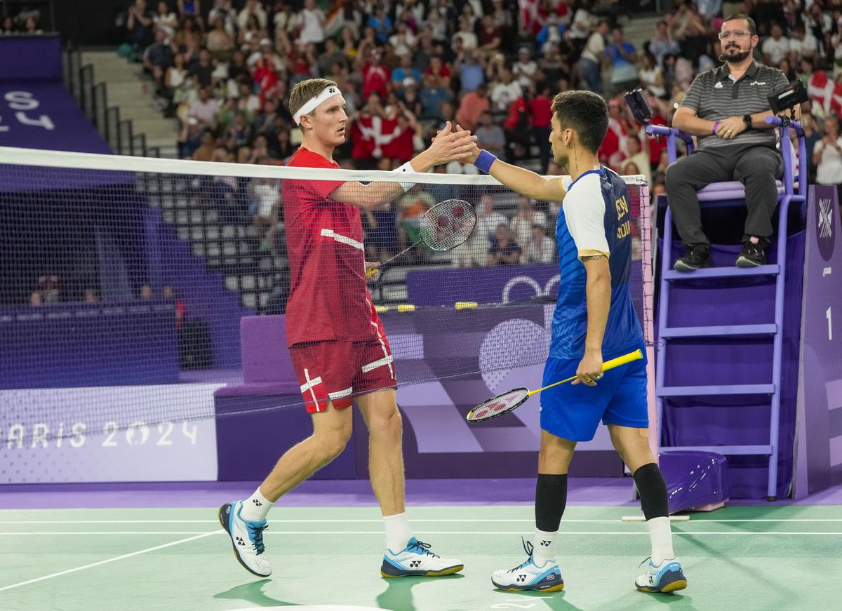 India’s Lakshya Sen congratulates Denmark’s Viktor Axelsen for winning the Men’s Singles Semifinal badminton match. 