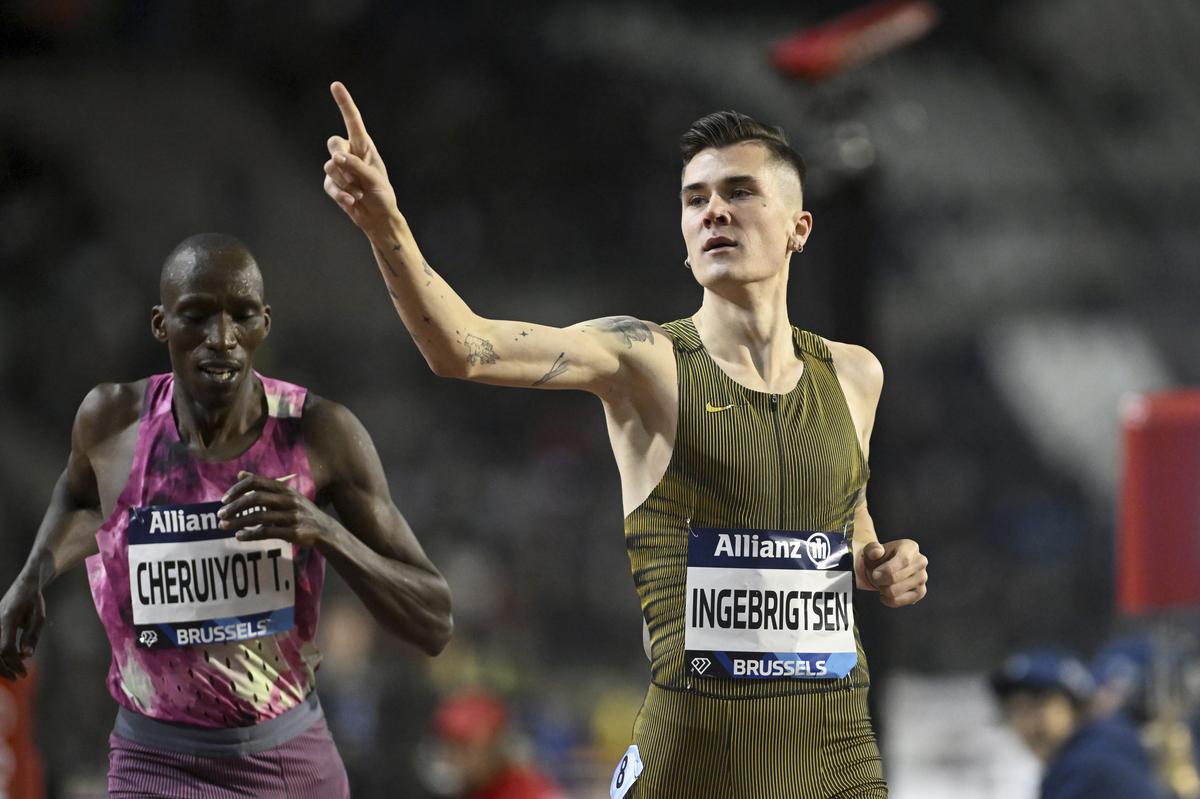 Jakob Ingebrigtsen, of Norway, crosses the finish line to win the men’s 1500 meters ahead of Timothy Cheruiyot, of Kenya, during the Diamond League final 2024 athletics meet in Brussels.